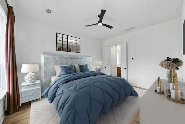 bedroom with ceiling fan and light hardwood / wood-style flooring