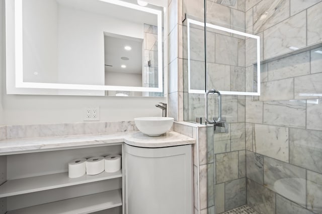 full bathroom with vanity and a stall shower