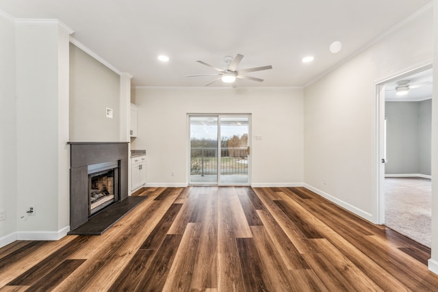 unfurnished living room featuring ornamental molding, dark hardwood / wood-style floors, and ceiling fan