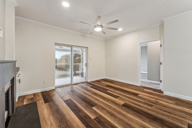 unfurnished living room with crown molding, ceiling fan, and dark wood-type flooring