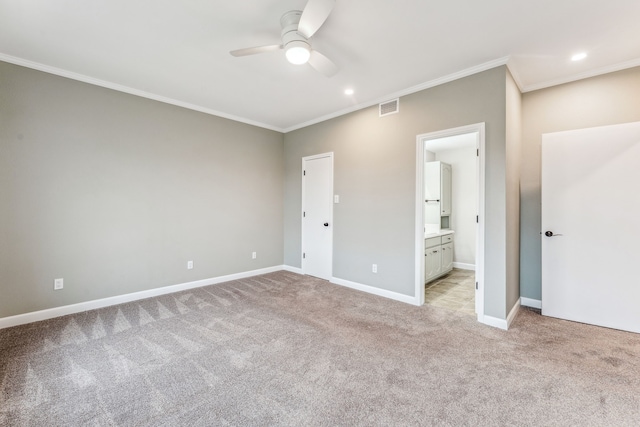 unfurnished bedroom with connected bathroom, crown molding, light colored carpet, and ceiling fan