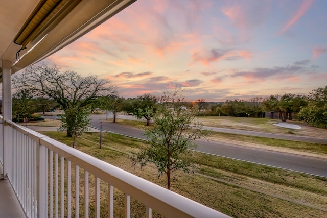 view of balcony at dusk