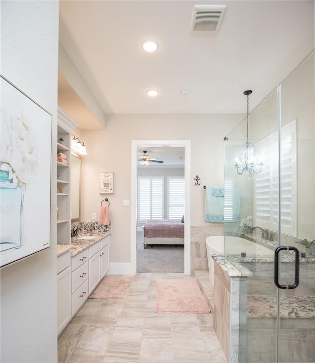 bathroom with vanity, separate shower and tub, and ceiling fan with notable chandelier