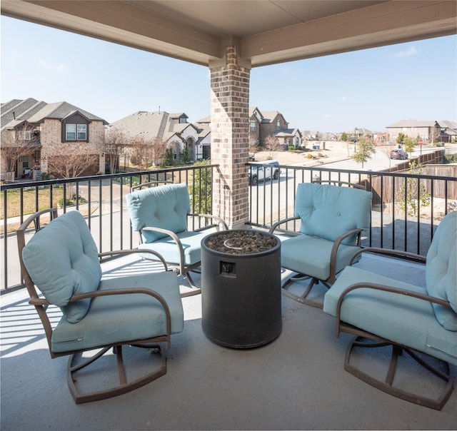 view of patio featuring a balcony