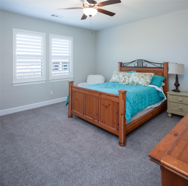 bedroom with dark carpet and ceiling fan