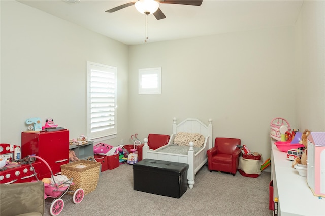 bedroom featuring ceiling fan and carpet