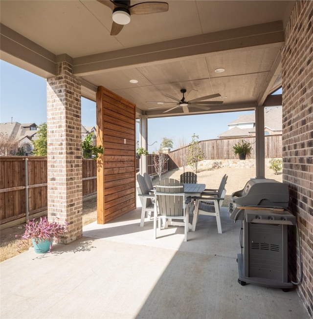 view of patio / terrace with ceiling fan and a grill