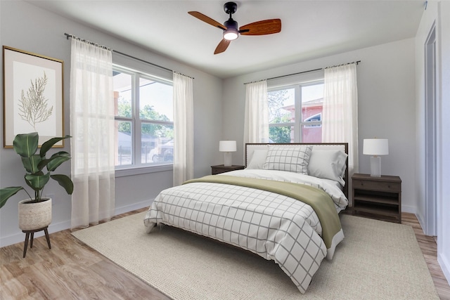 bedroom featuring ceiling fan and light wood-type flooring