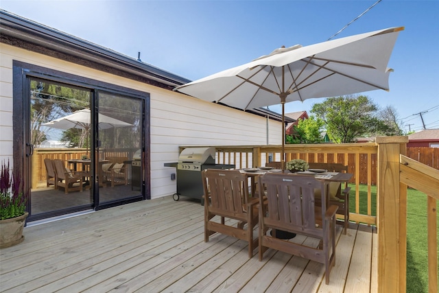 wooden deck featuring area for grilling