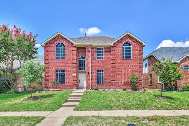 view of front facade with a front lawn