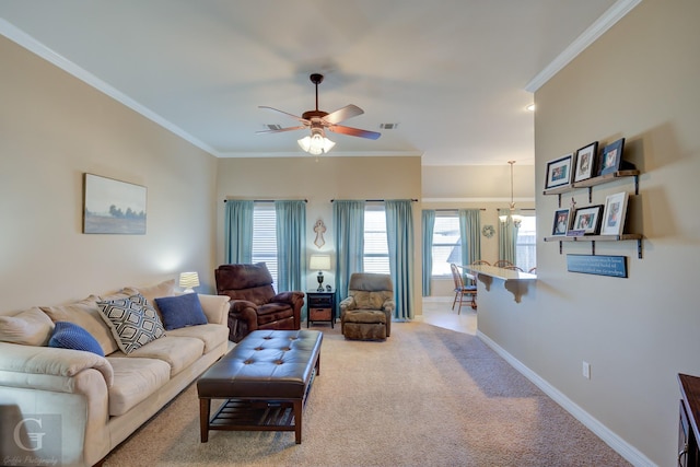 living room featuring ceiling fan, ornamental molding, and carpet floors