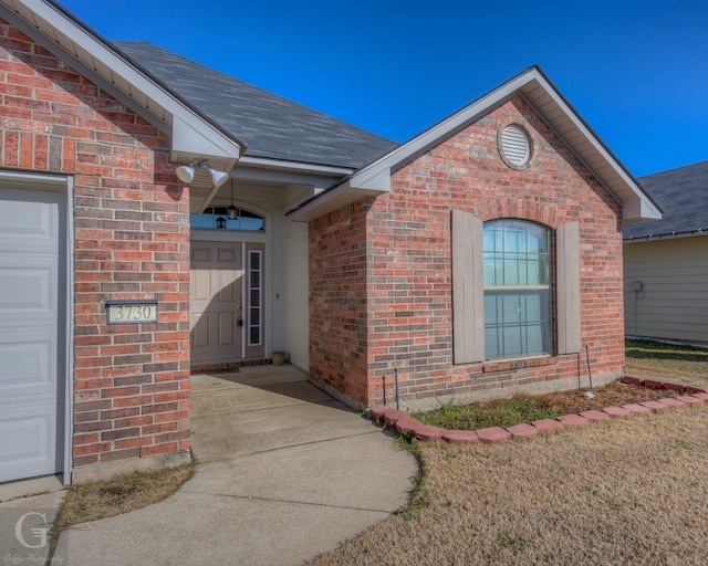 doorway to property featuring a garage