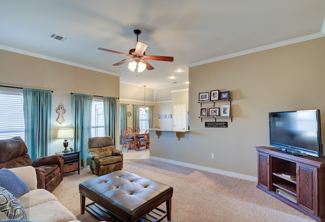 carpeted living room with ornamental molding and ceiling fan