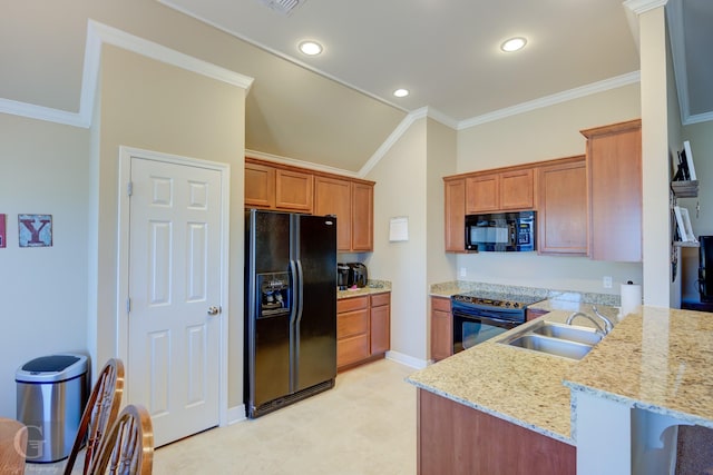 kitchen with ornamental molding, sink, light stone counters, and black appliances