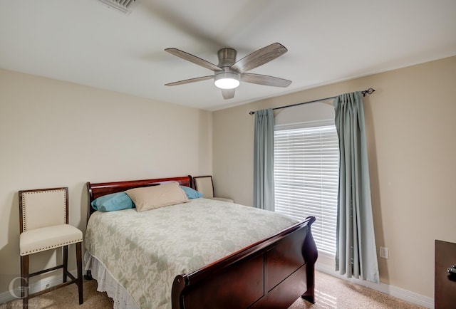 bedroom featuring light carpet and ceiling fan