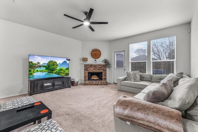 living room featuring ceiling fan, carpet floors, and a brick fireplace