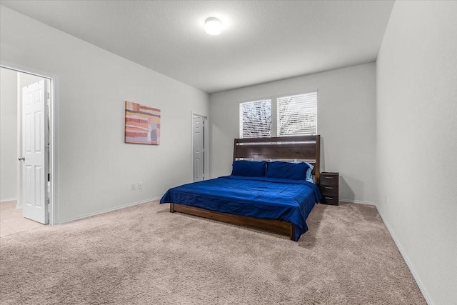 carpeted bedroom with a textured ceiling