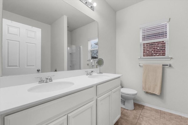 bathroom featuring vanity, toilet, an enclosed shower, and tile patterned flooring