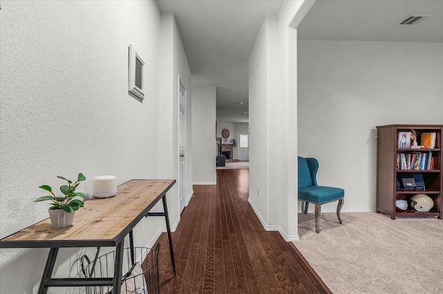 hallway with dark hardwood / wood-style floors