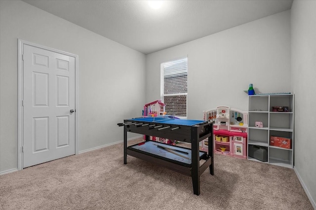 recreation room with light carpet