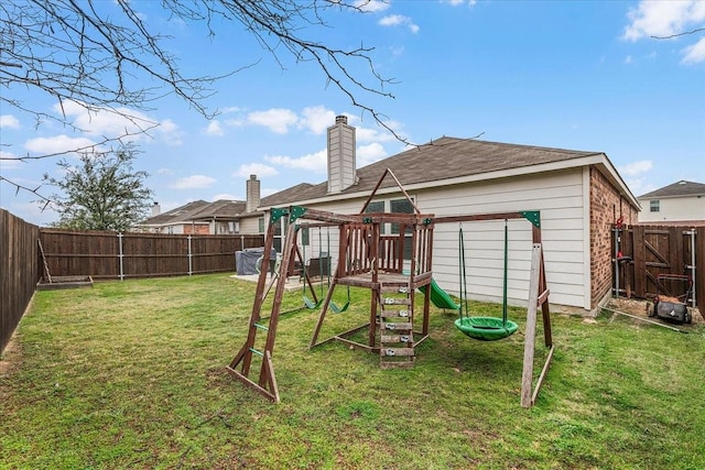 view of playground with a lawn