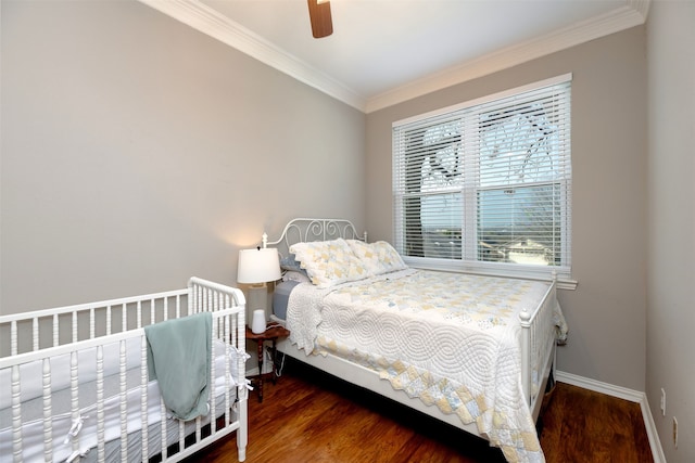 bedroom with crown molding, ceiling fan, and dark hardwood / wood-style flooring