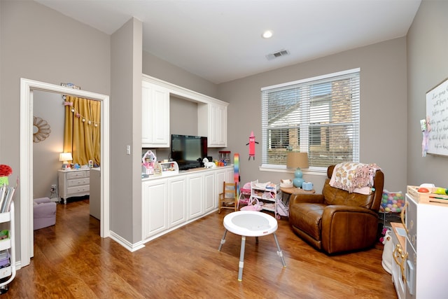 living area with hardwood / wood-style floors