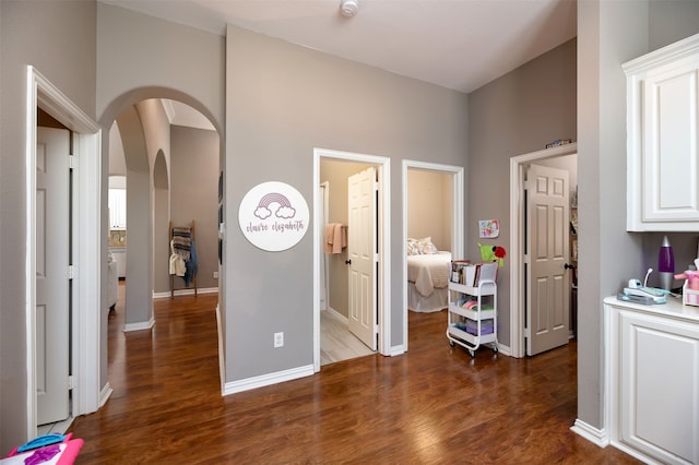 hallway with dark wood-type flooring