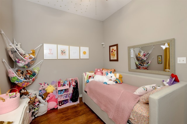 bedroom with dark wood-type flooring