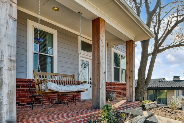 doorway to property featuring covered porch