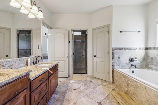 bathroom featuring vanity, a bath, a stall shower, and tile patterned flooring