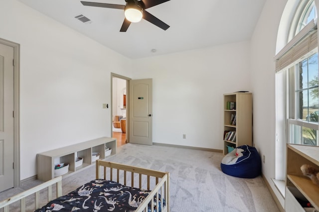 bedroom featuring visible vents, carpet floors, baseboards, and ceiling fan