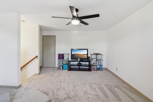 interior space with a ceiling fan, baseboards, and visible vents