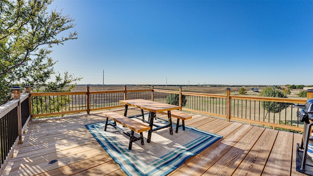 wooden deck featuring outdoor dining area