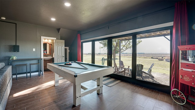 rec room with billiards, a sink, a textured ceiling, wood finished floors, and recessed lighting