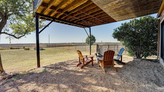 view of yard with a patio area, a rural view, and a fenced backyard