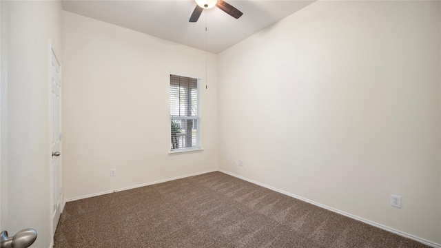 unfurnished room with ceiling fan and dark colored carpet