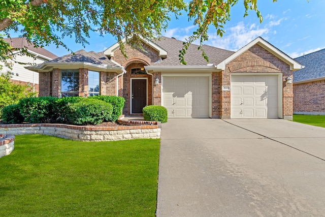 ranch-style house with a garage and a front yard