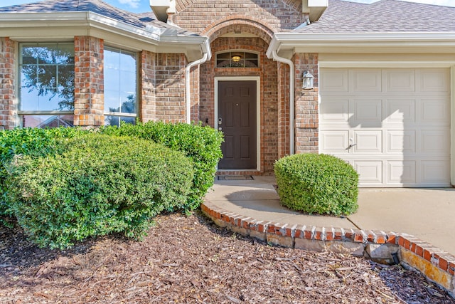 property entrance with a garage