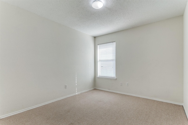 3956 Silver Springs Dr, Fort Worth, TX 76123 - empty room with carpet, a textured ceiling, and baseboards
