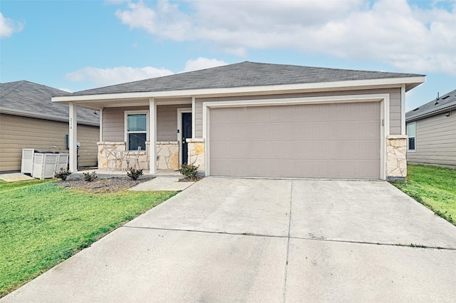 ranch-style house featuring cooling unit, a garage, a front lawn, and covered porch