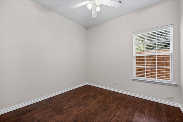 spare room featuring hardwood / wood-style floors and ceiling fan