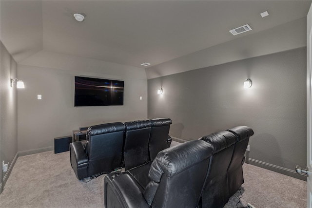 home theater room featuring light carpet