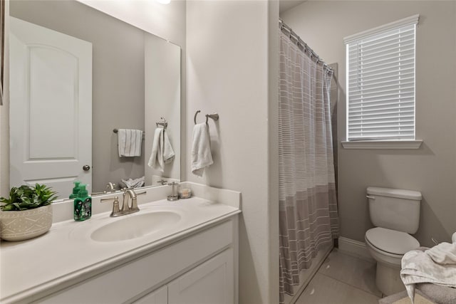 bathroom with tile patterned flooring, vanity, a shower with curtain, and toilet