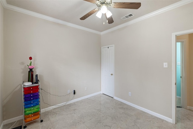 interior space featuring ornamental molding and ceiling fan