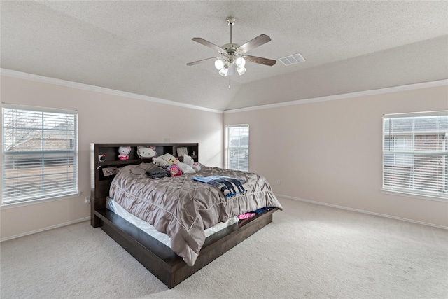 bedroom with multiple windows, vaulted ceiling, and carpet floors