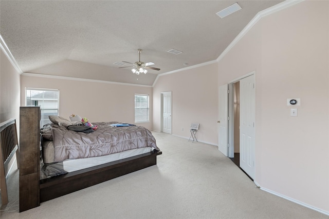 carpeted bedroom with ceiling fan, ornamental molding, vaulted ceiling, and a textured ceiling