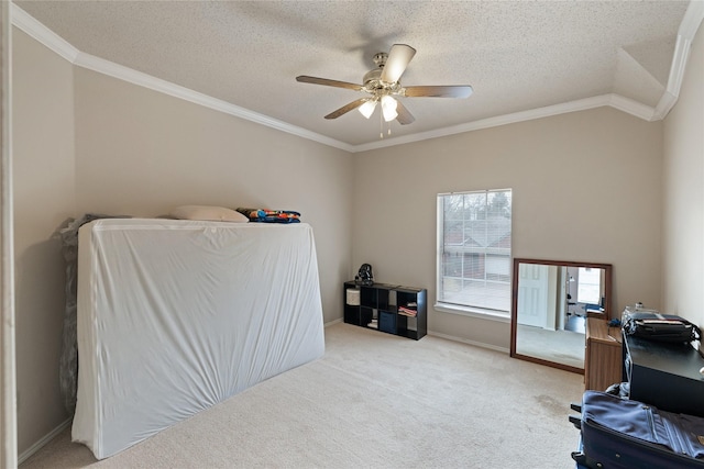 carpeted bedroom with ceiling fan, ornamental molding, and a textured ceiling