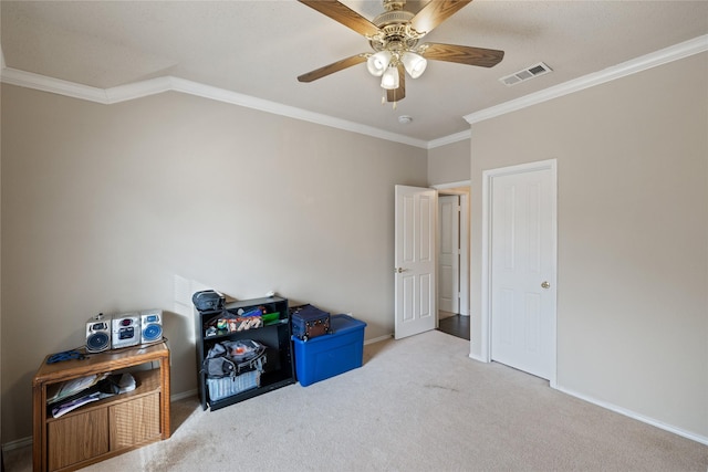 carpeted bedroom featuring crown molding and ceiling fan