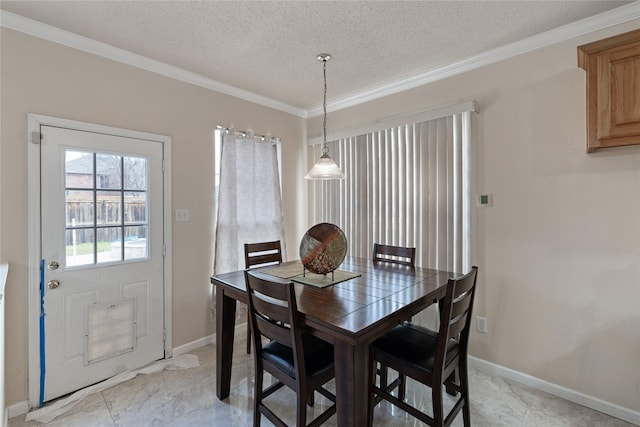 dining area with crown molding and a textured ceiling